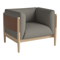 Gray upholstered chair with wooden legs and a brown accent panel, featuring a modern, minimalist design.
