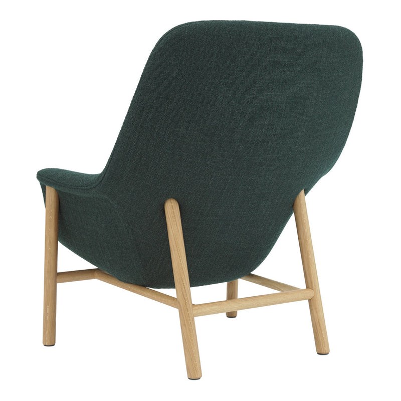 Green upholstered mid-century modern chair with light oak legs and a smooth textured back.