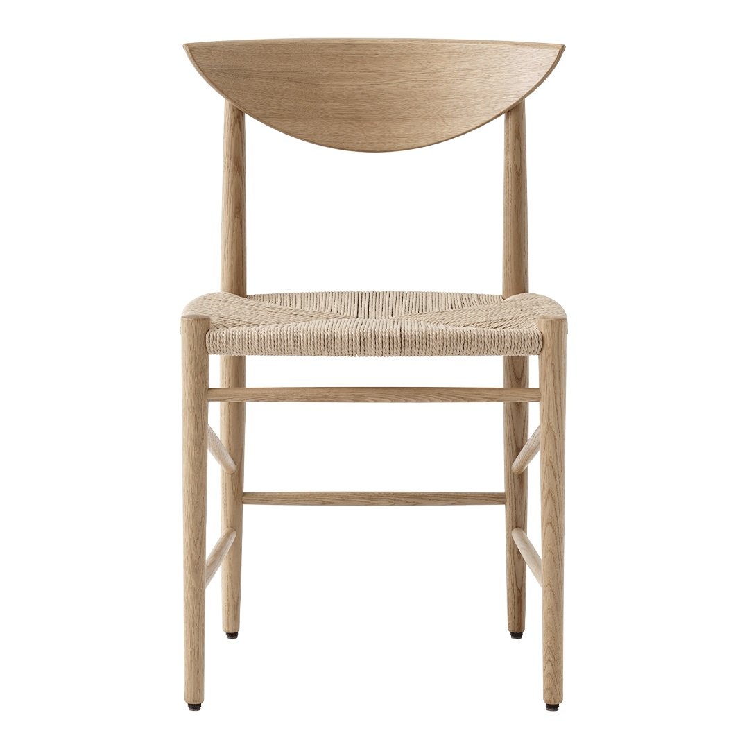 Natural wood chair with a curved backrest and woven seat, featuring a light beige color and minimalist design.