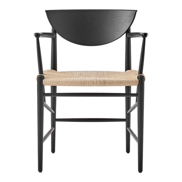 Black wooden chair with a half-moon backrest and natural woven seat, featuring a minimalist design.