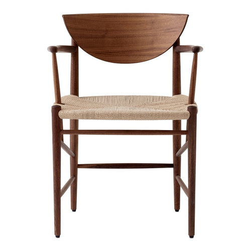 Brown wooden chair with a curved backrest and natural woven seat, featuring a minimalist design and clean lines.