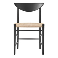 Black wooden chair with a curved backrest and natural woven seat, showcasing a minimalist, modern design.