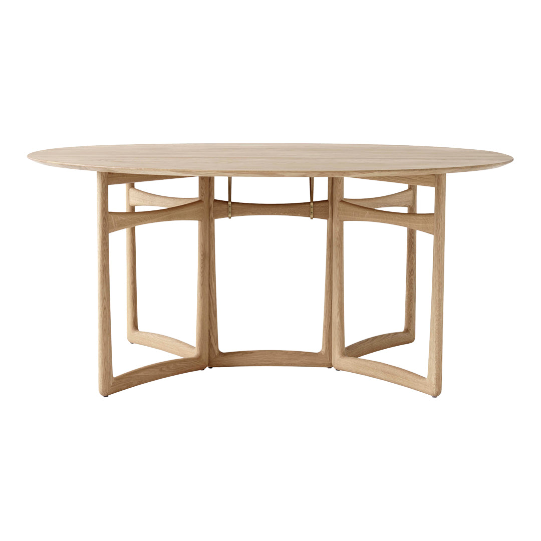 Light wood oval dining table with simple, modern lines and a natural finish, showcasing a minimalist design.