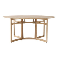 Light wood oval dining table with simple, modern lines and a natural finish, showcasing a minimalist design.
