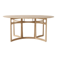 Light wood oval dining table with simple, modern lines and a natural finish, showcasing a minimalist design.