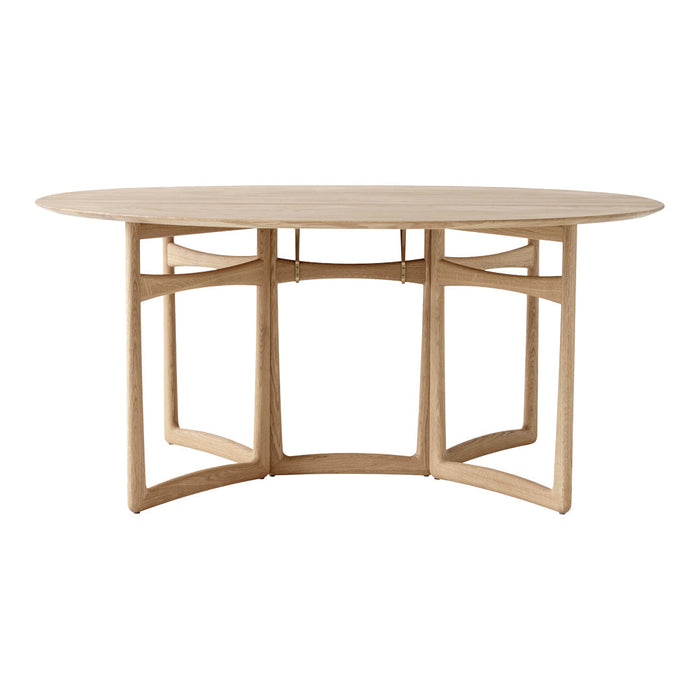 Light wood oval dining table with simple, modern lines and a natural finish, showcasing a minimalist design.