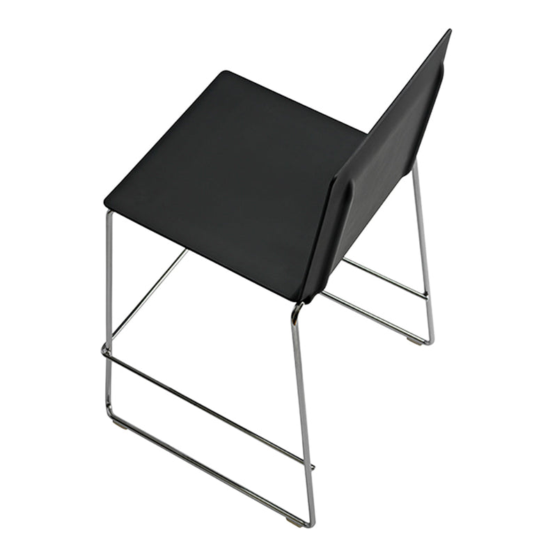 Black minimalist chair with a sleek design and chrome legs, perfect for modern decor. Simple and elegant.