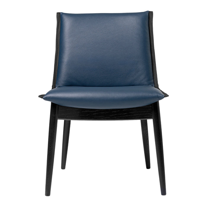 Navy blue leather chair with a sleek black wooden frame and simple, modern design.