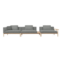 Modern sectional sofa in soft gray fabric with a minimalist design and light wood accents. Perfect for contemporary spaces.