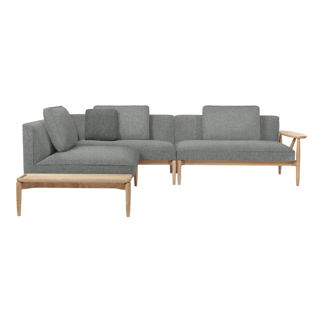Gray upholstered sectional sofa with a minimalist design and natural wooden accents.