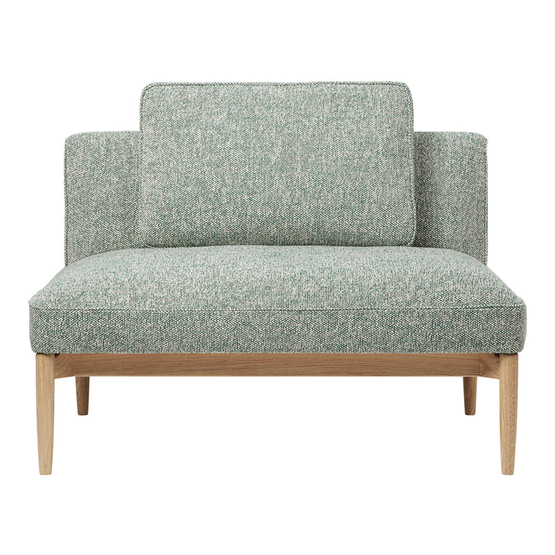 Green patterned loveseat with textured fabric and light wood legs, perfect for modern living spaces.