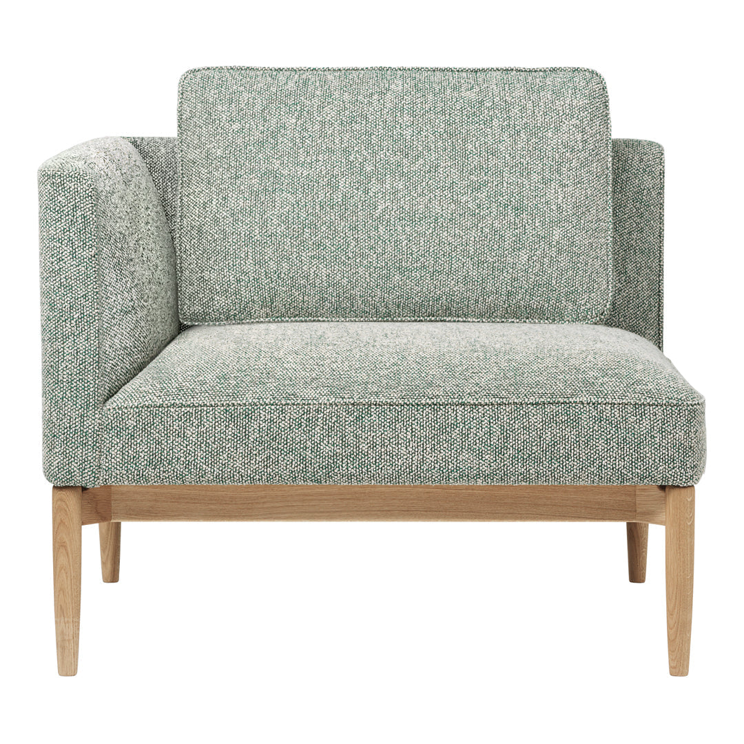 Textured mint green upholstery with subtle speckled pattern, paired with light wood legs. Perfect for modern decor.