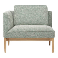 Textured mint green upholstery with subtle speckled pattern, paired with light wood legs. Perfect for modern decor.