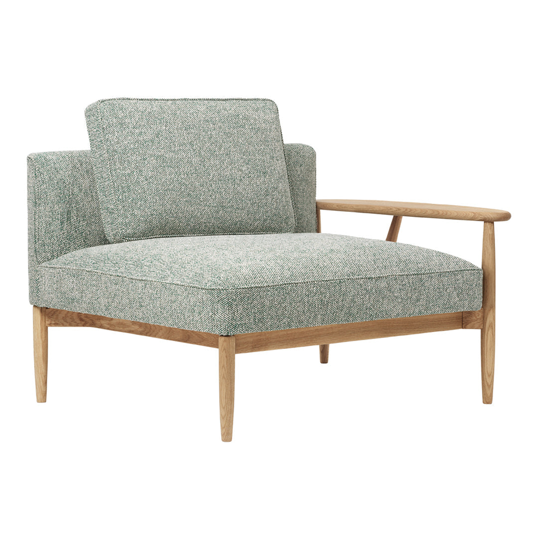 Light green textured upholstery on a mid-century modern chair with natural wood armrests and legs.