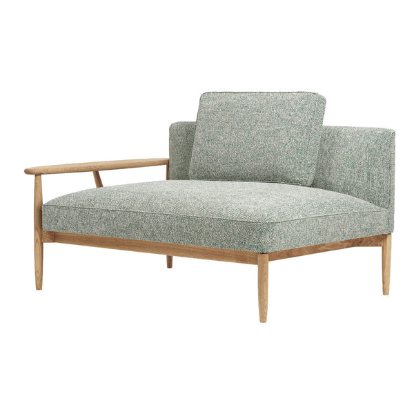 Mint green upholstered chair with a subtle floral pattern and light wood accents. Modern and stylish design.