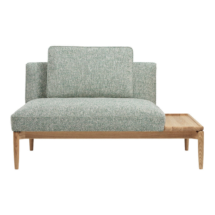 Soft green textured upholstery with a natural wood finish, combining modern design and cozy aesthetics.