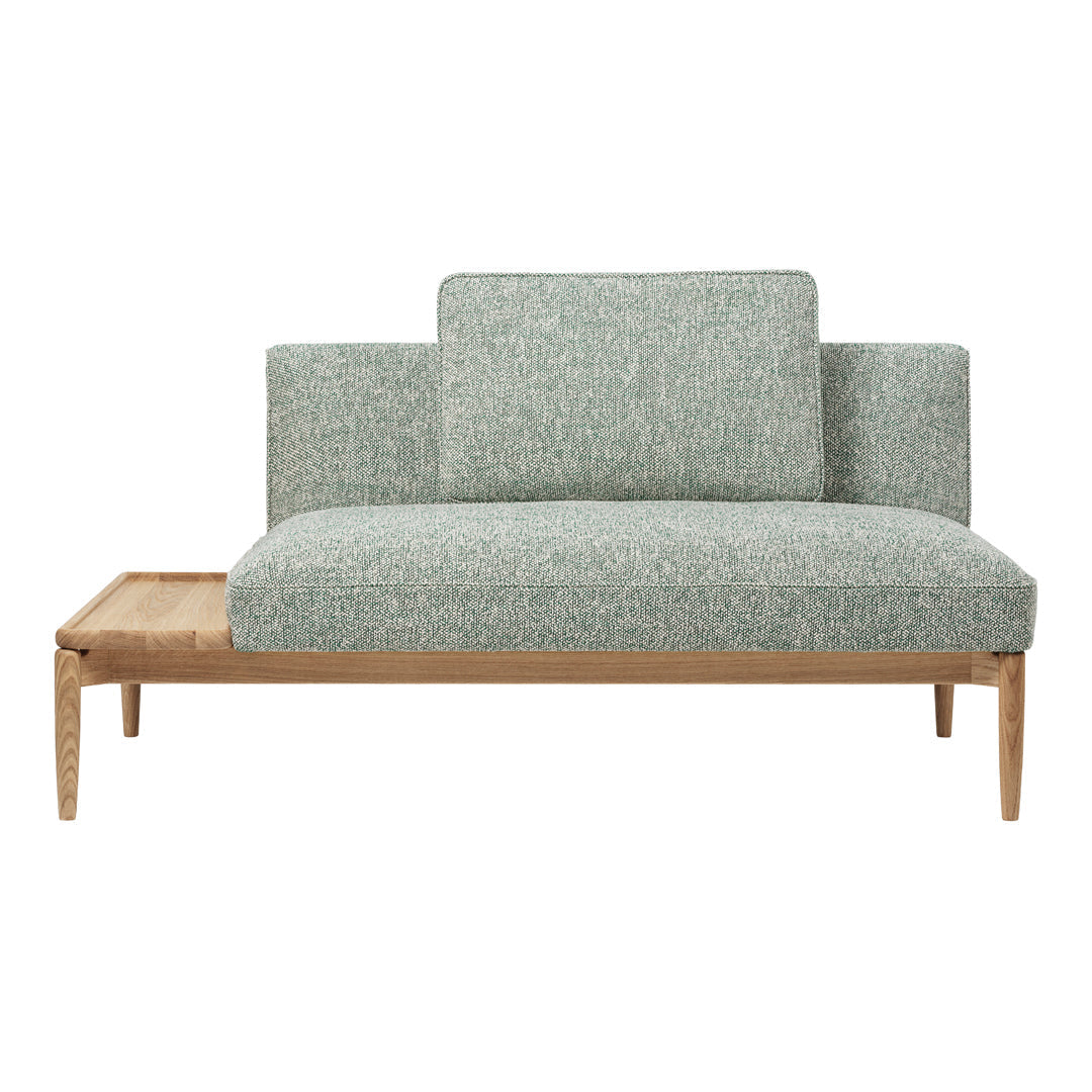 Light teal and cream speckled upholstery on a modern two-tone wooden sofa. Elegant, minimalist design.