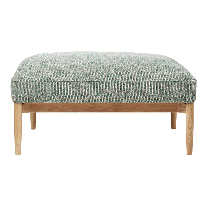 Green textured ottoman with a subtle pattern, featuring light wooden legs for a modern touch.