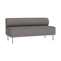 Grey upholstered sofa with a rounded back and sleek metal legs, showcasing a minimalist design.
