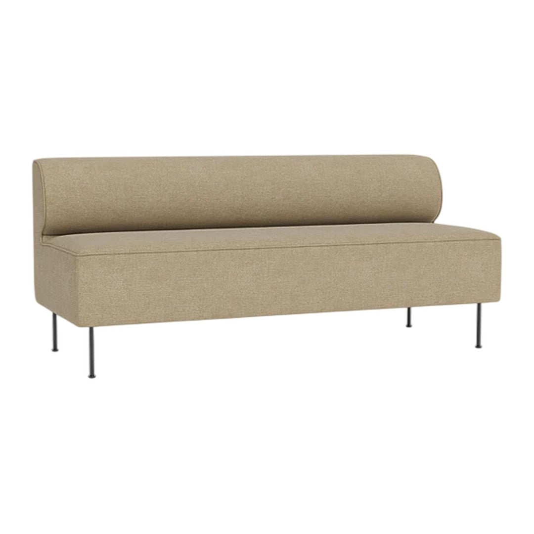 Sleek beige sofa with a minimalist design and smooth upholstery, featuring a rounded back and metal legs.