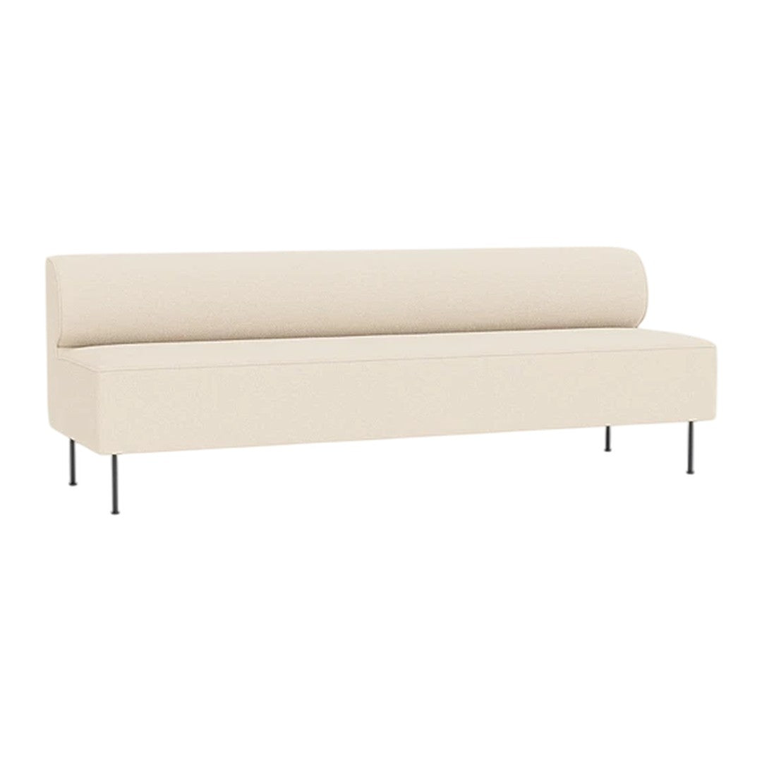 Cream-colored, minimalist sofa with a smooth fabric finish and sleek, silver legs, ideal for modern decor.