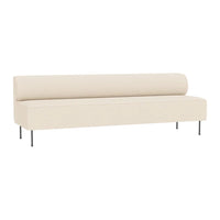 Cream-colored minimalist sofa with a sleek, smooth design and metal legs, perfect for modern decor.