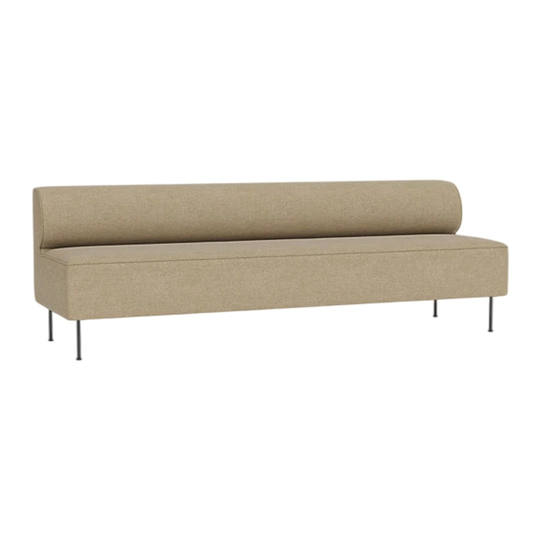 Light tan upholstered sofa with a smooth finish and minimalist design, featuring clean lines and silver legs.