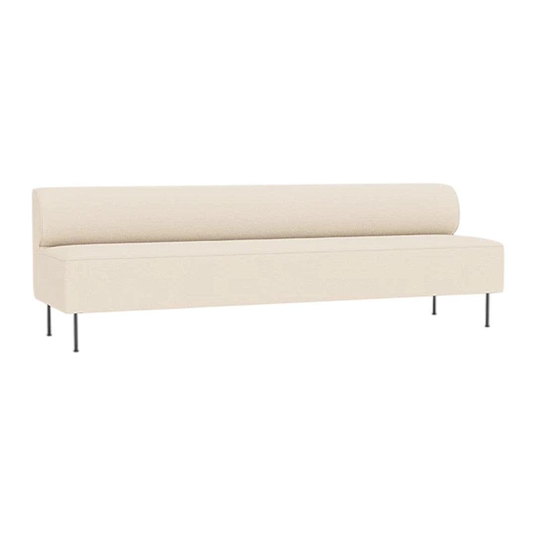 Beige upholstered sofa with a smooth, minimalist design and sleek metal legs.