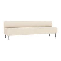 Beige upholstered sofa with a smooth, minimalist design and sleek metal legs.