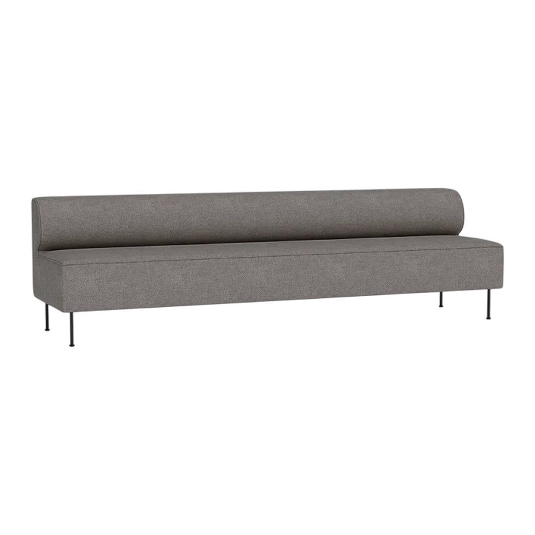 Gray minimalist sofa with a smooth texture and streamlined design, featuring a cylindrical backrest and sleek metal legs.