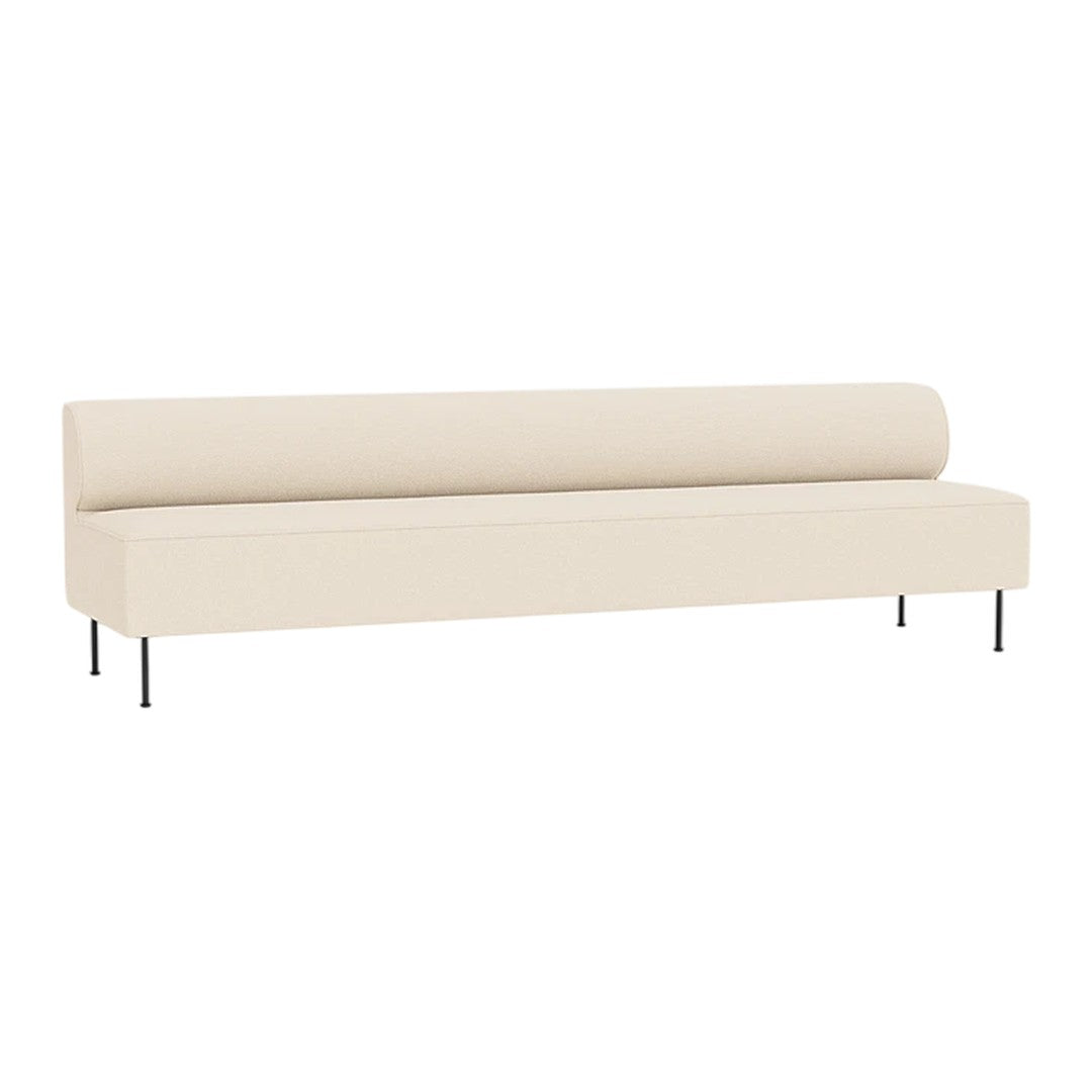 Minimalist cream sofa with a smooth surface and rounded backrest, featuring sleek black legs. Perfect for modern decor.