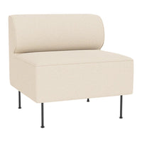 Beige upholstered chair with a minimalist design and black metal legs, featuring a smooth, solid color pattern.