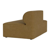 "Curved, modern chaise lounge upholstered in warm tan fabric with a textured finish."