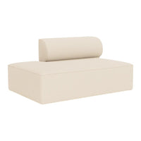 Cream-colored modern sofa with a cylindrical back cushion, featuring a minimalist design and smooth textures.