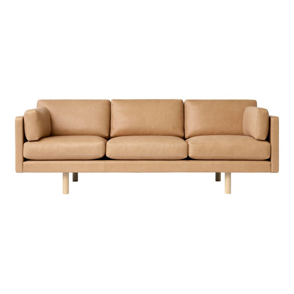 Stylish tan leather sofa with a sleek, minimalistic design and light wooden legs. Perfect for modern decor.