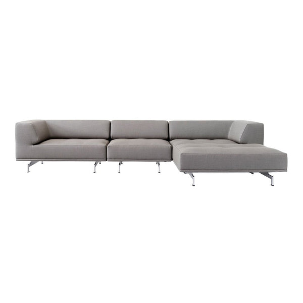 Modern light gray sectional sofa with a minimalist design and sleek metal legs, featuring a soft, tufted texture.