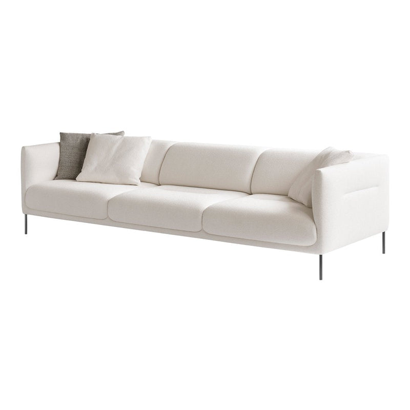 Modern white sofa with two decorative gray pillows, featuring a sleek, minimalist design and smooth fabric texture.
