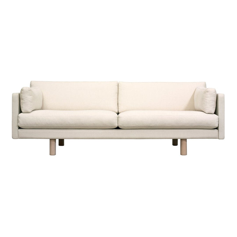 Stylish cream sofa with a minimalist design and soft texture, featuring two matching cushions and natural wood legs.