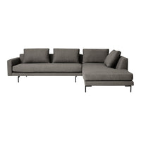 Gray sectional sofa with textured fabric and modern silhouette on black metal legs. Ideal for stylish living spaces.