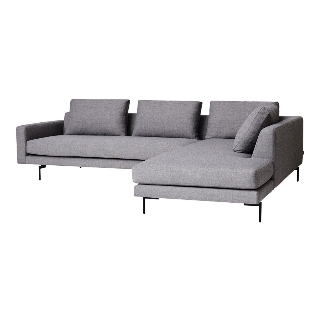 Gray sectional sofa with clean lines and soft fabric, featuring a minimalist design and three supportive cushions.