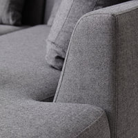 Gray textured fabric sofa with modern, clean lines and subtle patterns for a contemporary look.