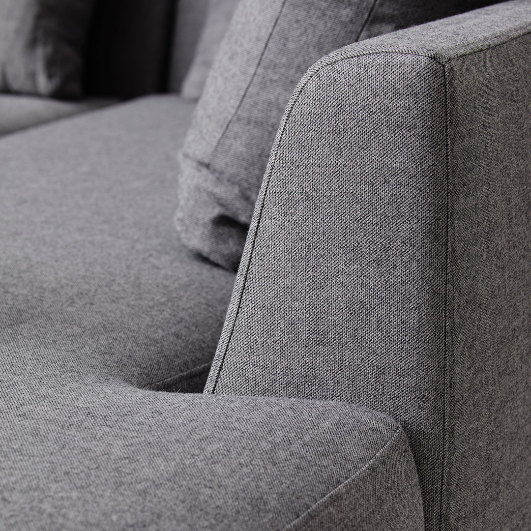 Gray textured sofa fabric with subtle patterns, showcasing a modern and minimalist design.