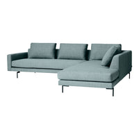 Modern light teal sectional sofa with a sleek design and soft fabric, featuring three back cushions and a chaise.