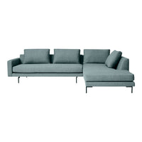 Contemporary sectional sofa in soft teal fabric with clean lines and plush cushions. Ideal for modern living spaces.
