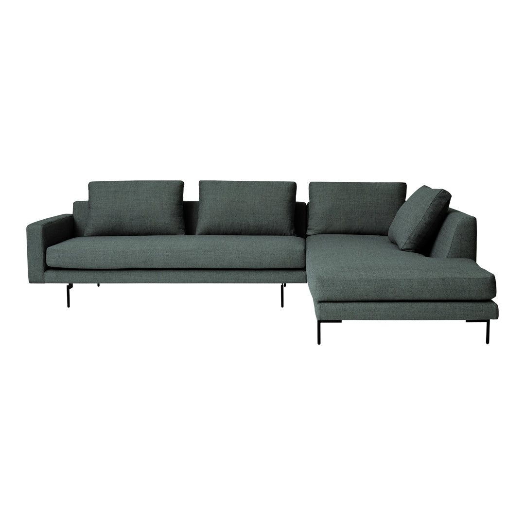 Modern dark green sectional sofa with sleek lines and minimalist design, featuring a soft fabric upholstery.