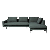Dark green sectional sofa with sleek lines and modern design, featuring solid upholstery and minimalist black legs.