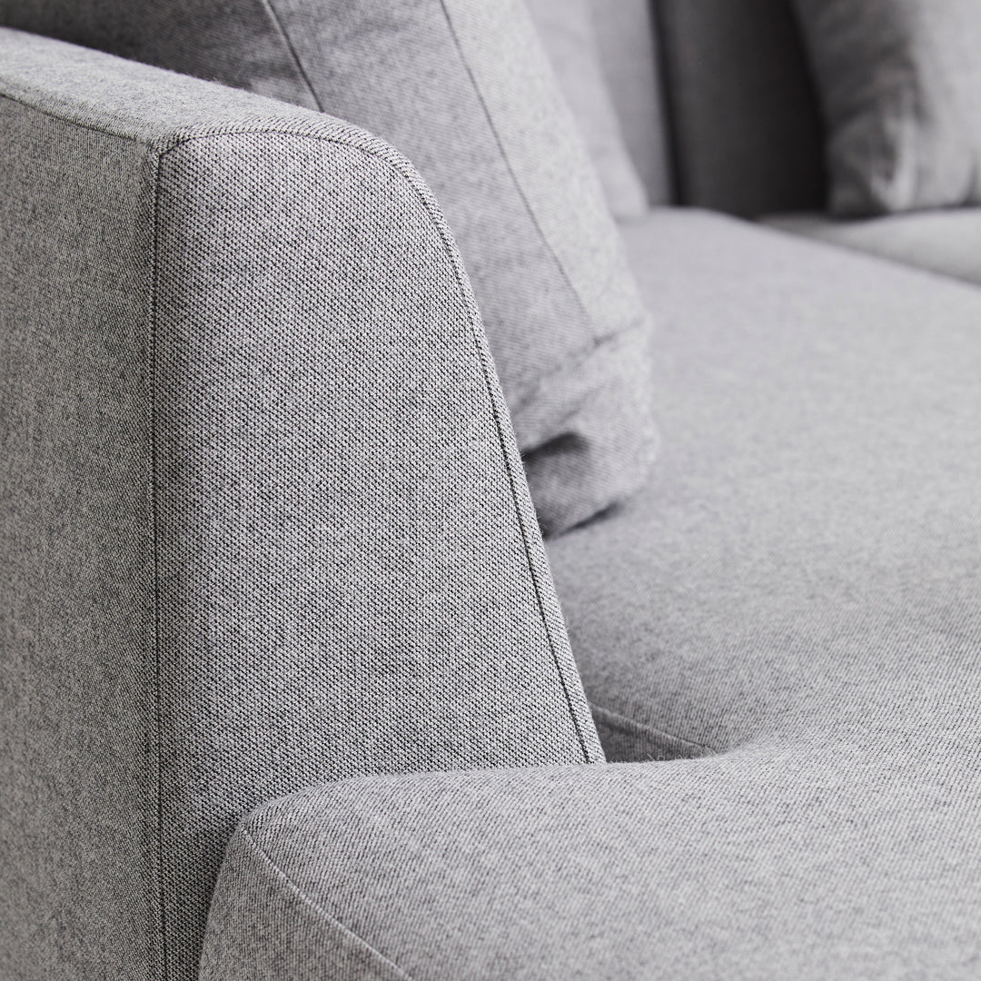 Light gray textured fabric sofa with a modern design and soft, subtle patterns. Perfect for contemporary interiors.