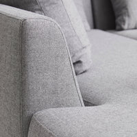 Light gray textured fabric sofa with a modern design and soft, subtle patterns. Perfect for contemporary interiors.