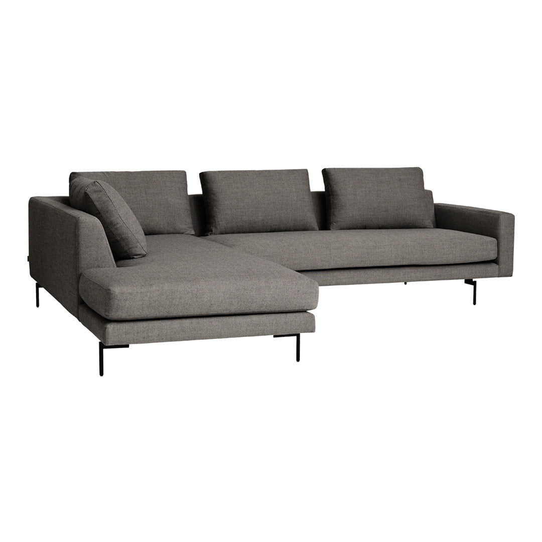 Gray sectional sofa with a sleek design, featuring a soft fabric finish and minimalist black metal legs.