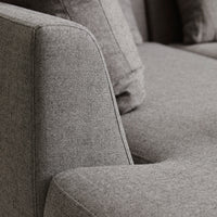 Gray textured sofa fabric with a contemporary design, featuring a smooth finish and subtle patterns.